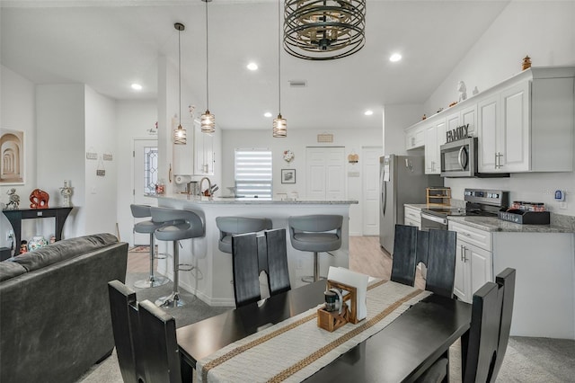 dining area featuring an inviting chandelier, visible vents, recessed lighting, and light colored carpet
