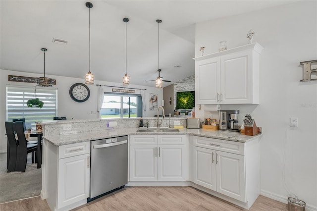 kitchen with stainless steel dishwasher, light wood finished floors, a sink, and visible vents