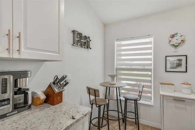 dining area featuring baseboards