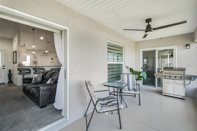view of patio featuring grilling area and a ceiling fan