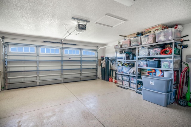 garage featuring a garage door opener