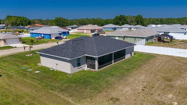 birds eye view of property with a residential view