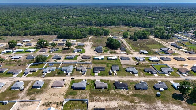 drone / aerial view with a view of trees