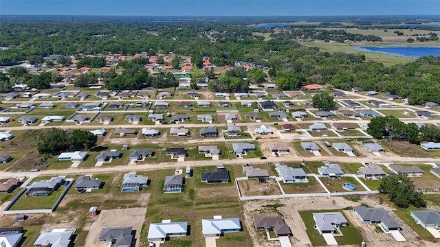 drone / aerial view with a residential view and a water view