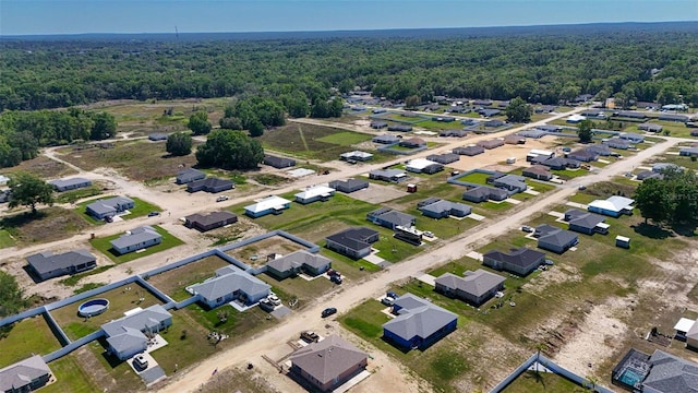 aerial view featuring a view of trees and a residential view