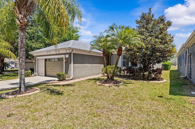 14820 Potterton Cir, Hudson, FL 34667 - view of front of house with stucco siding, an attached garage, a front yard, and concrete driveway