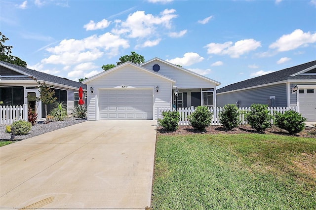 ranch-style home featuring fence, an attached garage, a front lawn, and concrete driveway