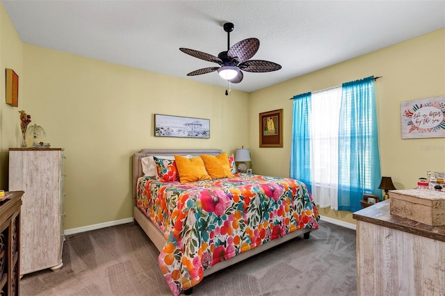 carpeted bedroom with baseboards and a ceiling fan