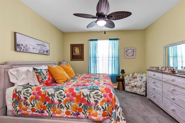 bedroom with carpet flooring, multiple windows, and a ceiling fan