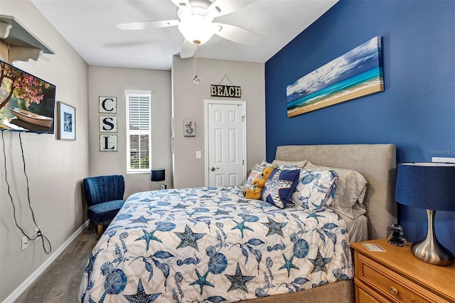 bedroom with carpet flooring, baseboards, and a ceiling fan