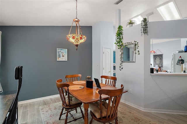 38 Townhill Dr, Eustis, FL 32726 - dining space with light wood finished floors, baseboards, and visible vents