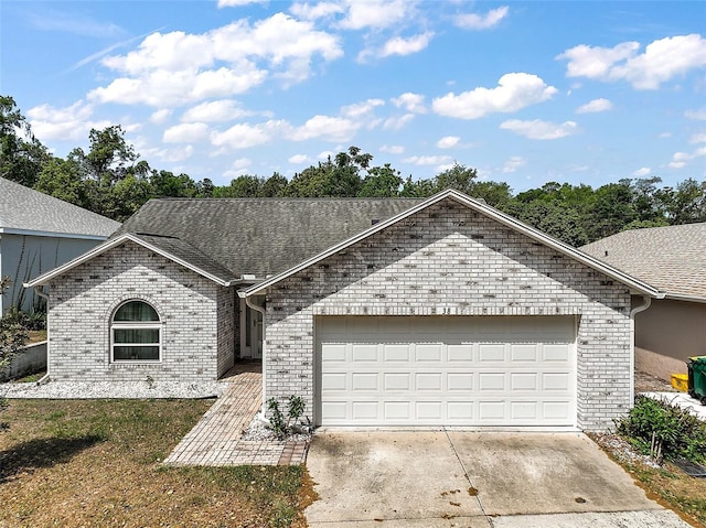 38 Townhill Dr, Eustis, FL 32726 - ranch-style house featuring brick siding, concrete driveway, and an attached garage