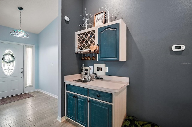 38 Townhill Dr, Eustis, FL 32726 - entryway with lofted ceiling, light wood-style floors, and baseboards