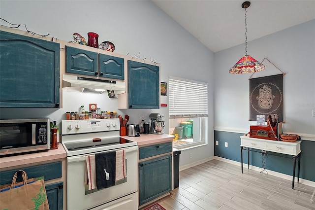 38 Townhill Dr, Eustis, FL 32726 - kitchen featuring lofted ceiling, stainless steel microwave, white range with electric stovetop, light countertops, and under cabinet range hood