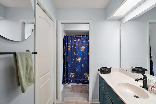 38 Townhill Dr, Eustis, FL 32726 - full bath featuring baseboards, wood finished floors, a shower with curtain, and vanity