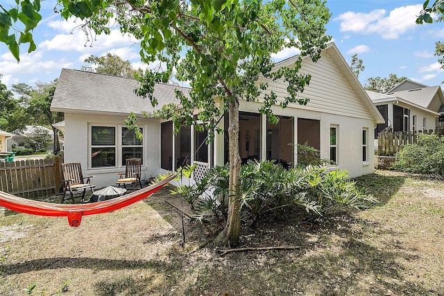 38 Townhill Dr, Eustis, FL 32726 - back of house featuring fence and stucco siding