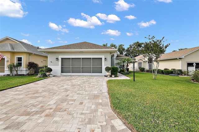 ranch-style house with stucco siding, decorative driveway, a front yard, and a garage