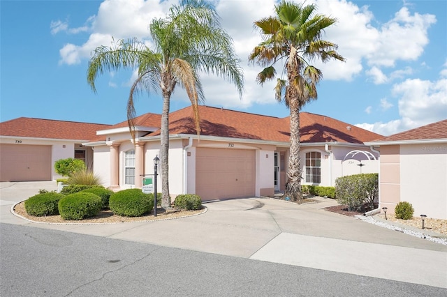 732 Ramirez Ave, The Villages, FL 32159 - view of front of house with an attached garage, driveway, and stucco siding