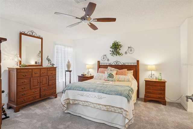 732 Ramirez Ave, The Villages, FL 32159 - bedroom with visible vents, a textured ceiling, carpet, and a ceiling fan