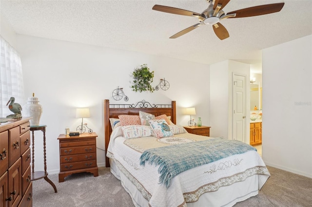 732 Ramirez Ave, The Villages, FL 32159 - bedroom featuring ceiling fan, light colored carpet, a textured ceiling, baseboards, and ensuite bathroom