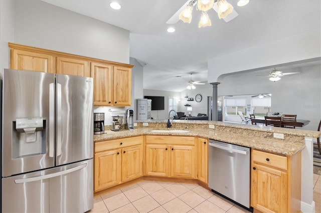 2120 Callaway Dr, The Villages, FL 32162 - kitchen featuring light brown cabinetry, appliances with stainless steel finishes, a sink, a ceiling fan, and open floor plan