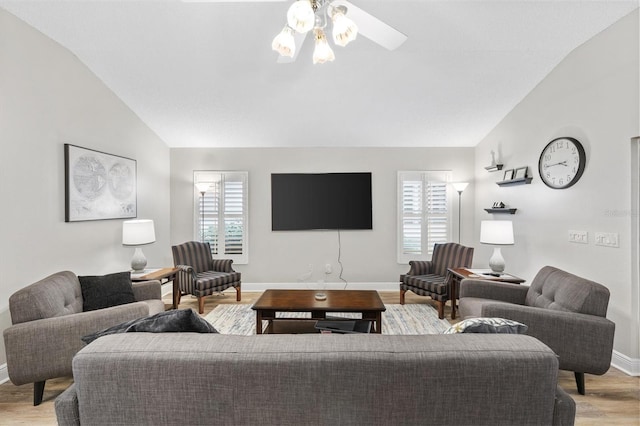 2120 Callaway Dr, The Villages, FL 32162 - living area featuring light wood finished floors, a ceiling fan, lofted ceiling, and baseboards