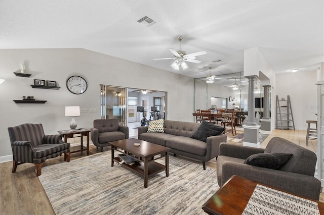 2120 Callaway Dr, The Villages, FL 32162 - living room featuring ceiling fan, decorative columns, light wood-type flooring, visible vents, and baseboards