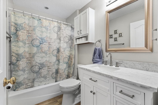 2120 Callaway Dr, The Villages, FL 32162 - full bathroom with a textured ceiling, shower / tub combo with curtain, toilet, wood finished floors, and vanity