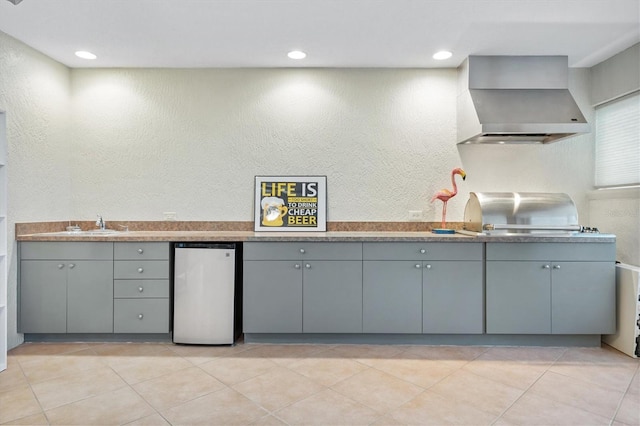 2120 Callaway Dr, The Villages, FL 32162 - kitchen with recessed lighting, wall chimney range hood, dishwasher, a textured wall, and gray cabinetry