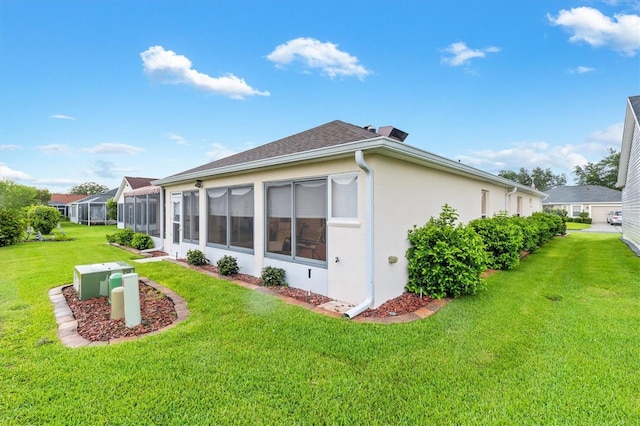 2120 Callaway Dr, The Villages, FL 32162 - rear view of property with a lawn and stucco siding