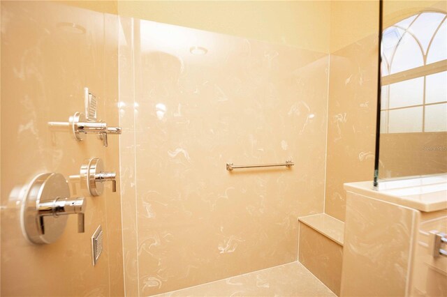 full bath featuring a tile shower