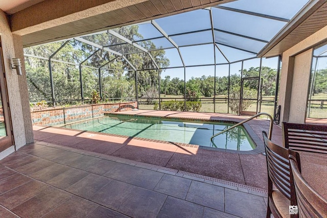 pool with a lanai and a patio