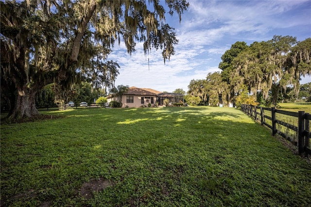 view of yard featuring fence
