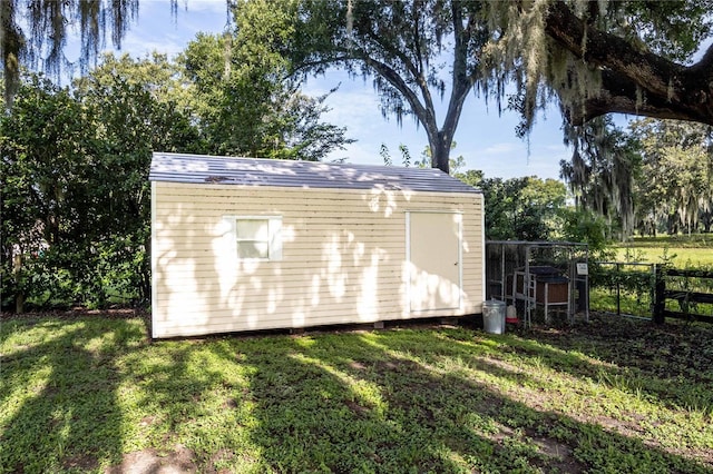 view of shed with fence