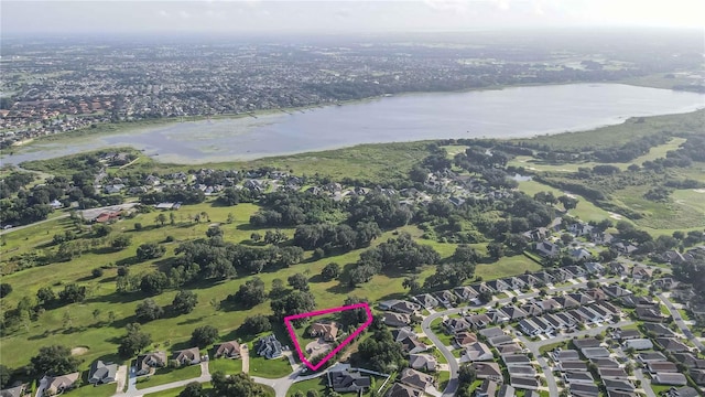 drone / aerial view featuring a water view and a residential view