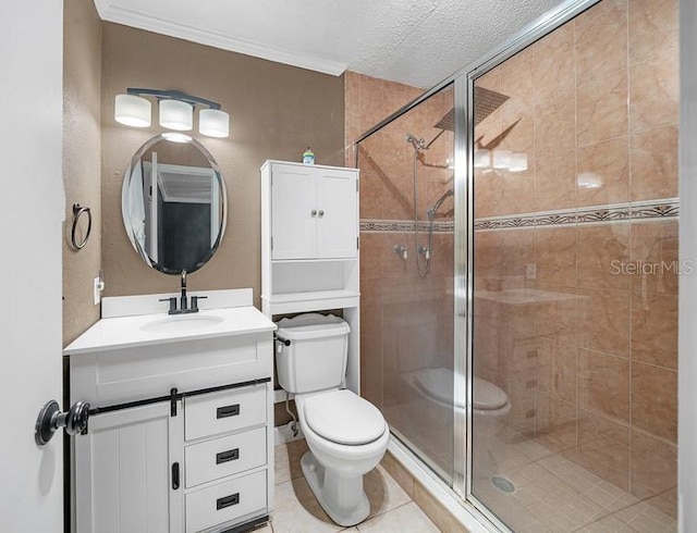 full bath featuring a stall shower, vanity, a textured ceiling, and toilet