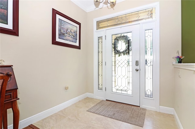 foyer entrance with baseboards and an inviting chandelier