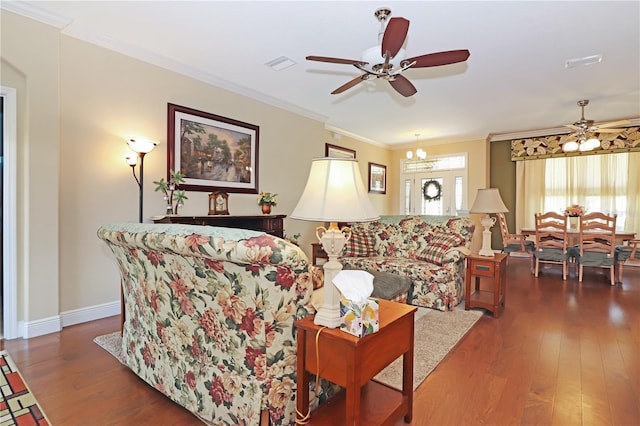 living room with wood finished floors, visible vents, and ceiling fan