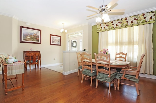 dining space with baseboards, ornamental molding, wood finished floors, and ceiling fan with notable chandelier