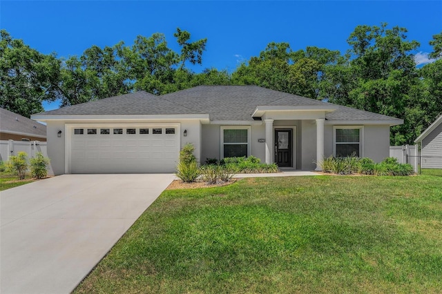 16380 SE 84th Ct, Summerfield, FL 34491 - ranch-style home featuring an attached garage, a front lawn, and fence