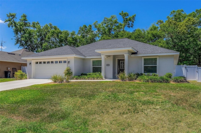 16380 SE 84th Ct, Summerfield, FL 34491 - ranch-style home with a garage, stucco siding, and a front yard
