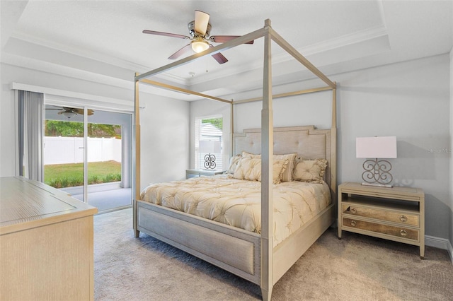 16380 SE 84th Ct, Summerfield, FL 34491 - bedroom featuring a ceiling fan, access to exterior, crown molding, a raised ceiling, and carpet flooring