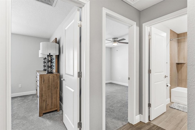 16380 SE 84th Ct, Summerfield, FL 34491 - hallway featuring baseboards, visible vents, and carpet