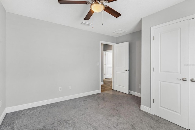 16380 SE 84th Ct, Summerfield, FL 34491 - unfurnished bedroom with baseboards, carpet flooring, ceiling fan, and visible vents