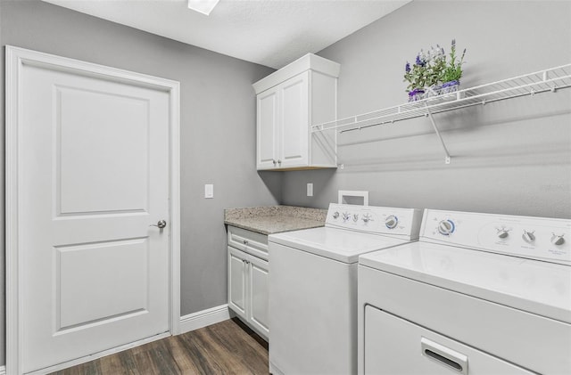 16380 SE 84th Ct, Summerfield, FL 34491 - laundry area featuring baseboards, washer and clothes dryer, cabinet space, and dark wood-style floors