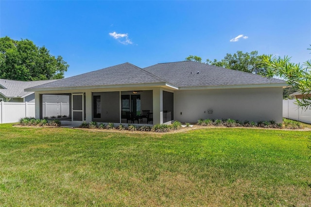 16380 SE 84th Ct, Summerfield, FL 34491 - back of property featuring fence, a lawn, and a sunroom