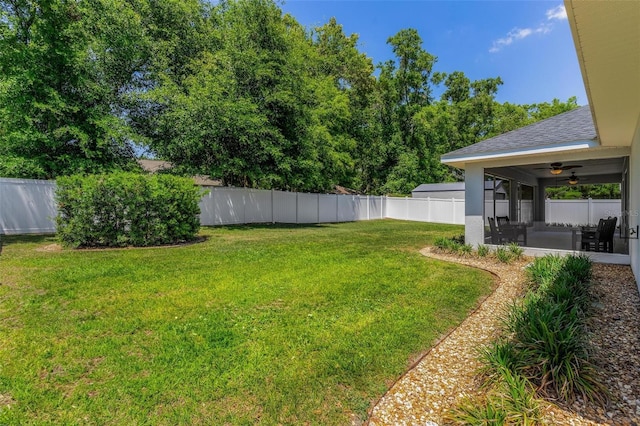 16380 SE 84th Ct, Summerfield, FL 34491 - view of yard featuring a ceiling fan, a fenced backyard, and a sunroom