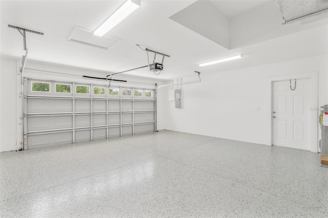 16380 SE 84th Ct, Summerfield, FL 34491 - garage with a garage door opener and electric panel