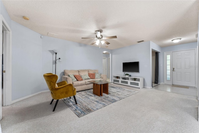4386 Sambourne St, Clermont, FL 34711 - living area with light carpet, arched walkways, and a textured ceiling