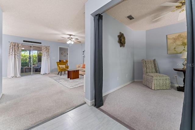 4386 Sambourne St, Clermont, FL 34711 - interior space featuring a textured ceiling, carpet flooring, a ceiling fan, and visible vents